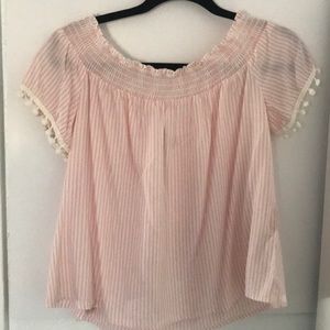 cute slightly see through pink ruffled shirt.